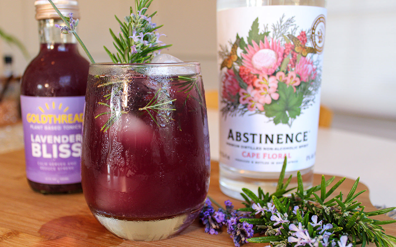 Goldthread Lavender Bliss Tonic and Abstinence Spirits Cape Floral Spirit with cocktail and rosemary and lavender sprigs