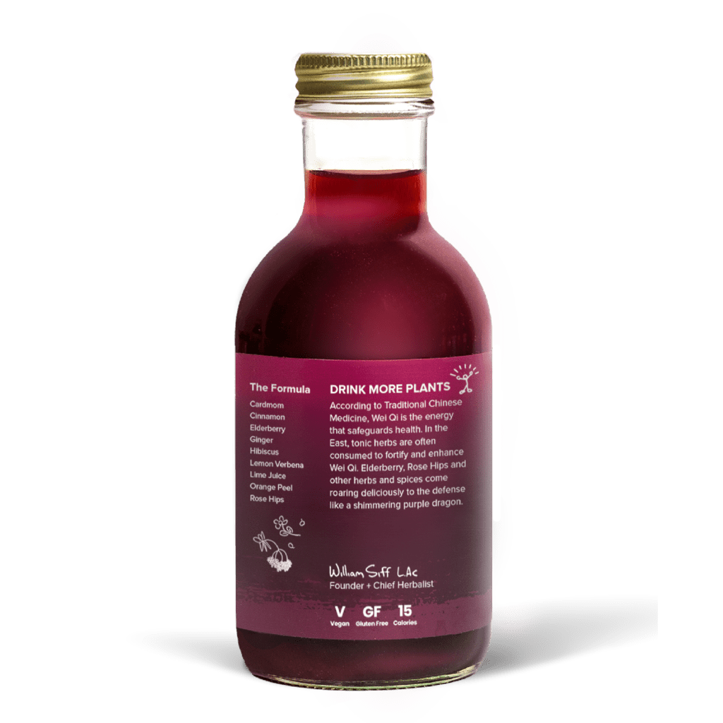 A glass bottle with a gold cap containing 10.5 fl oz (300 ml) of purple liquid. The purple label identifies the drink as Goldthread's Elderberry Defense plant-based tonic and features text reading "Boost Immunity and Carry On".