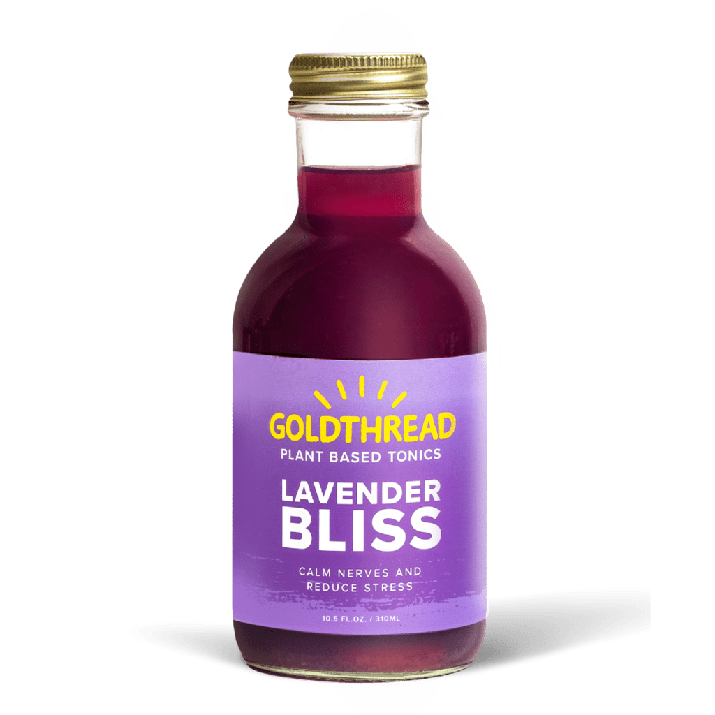 A glass bottle with a gold cap containing 10.5 fl oz (300 ml) of purple liquid. The purple label identifies the drink as Goldthread's Lavender Bliss plant-based tonic and features text reading "Calm Nerves and Reduce Stress".