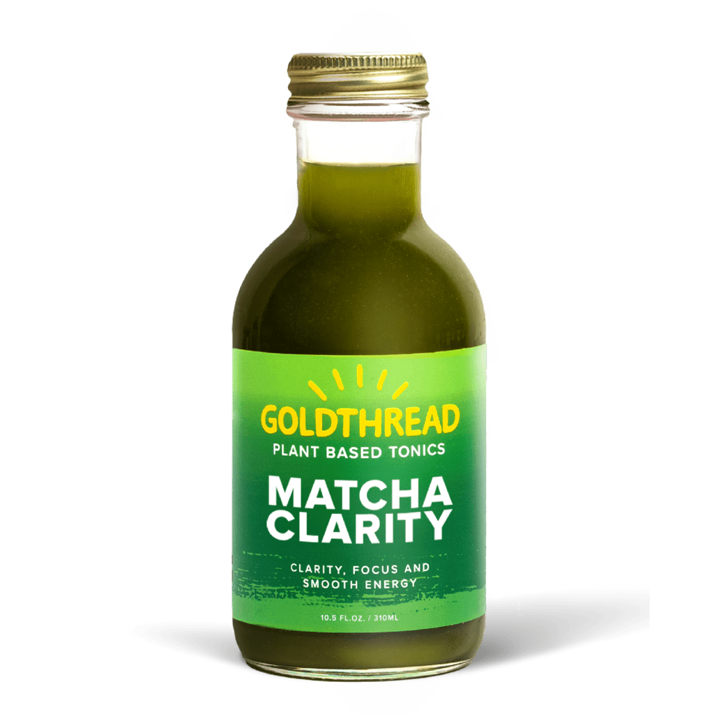 A glass bottle with a gold cap containing 10.5 fl oz (300 ml) of green liquid. The green label identifies the drink as Goldthread's Matcha Clarity plant-based tonic and features text reading "Clarity, Focus and Smooth Energy".