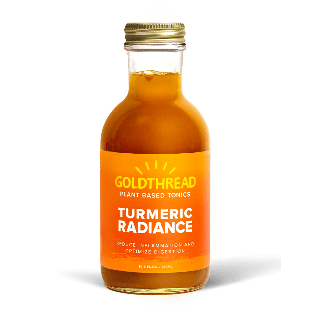 A glass bottle with a gold cap containing 10.5 fl oz (300 ml) of orange liquid. The orange label identifies the drink as Goldthread's Turmeric Radiance plant-based tonic and features text reading "Reduce Inflammation and Optimize Digestion".